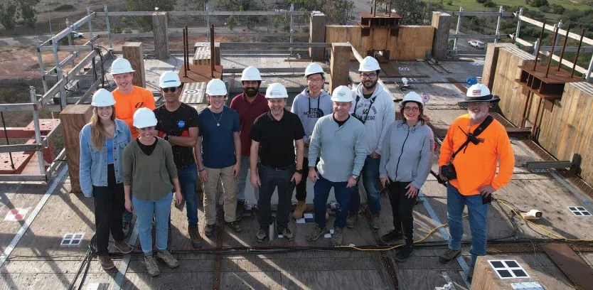 Construction workers posing as a group.