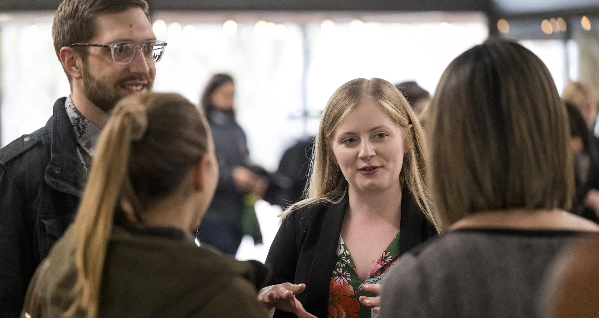 Student at a career event speakign to recruiters
